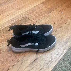 Black Vans sneakers. Women size 9, men size 7.5